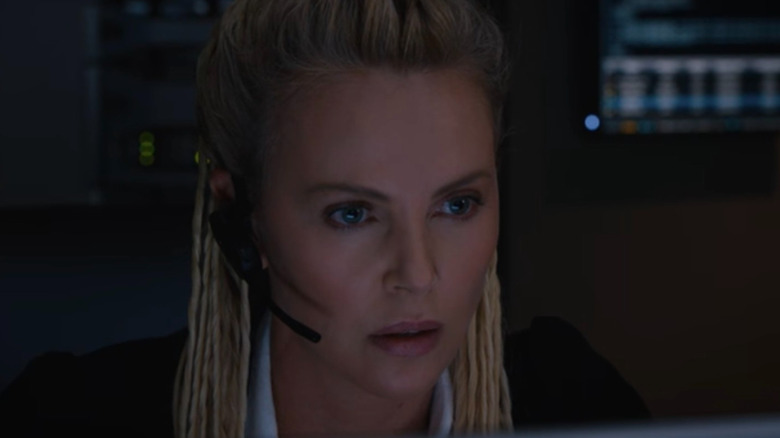 Cipher looking a computer screen in The Fate of the Furious