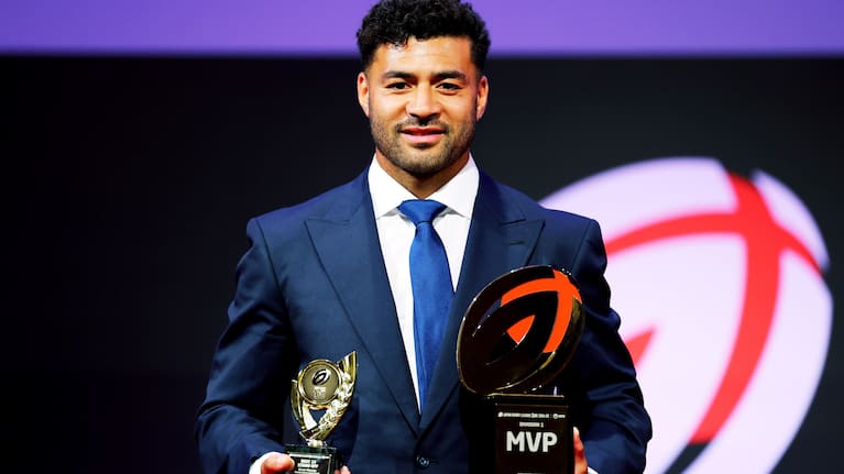 Toshiba player and returning All Black Richie Mo'unga displays his Japan League One awards in the middle of last year. 