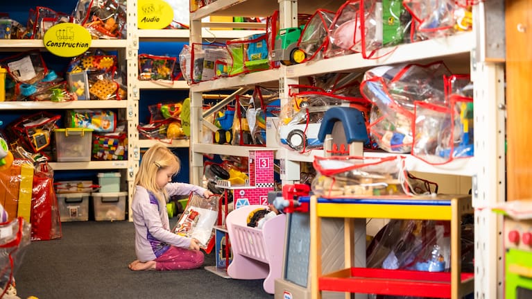 A child browses the selection at one of New Zealand's 160 toy libraries (supplied by the Toy Library Federation of NZ)