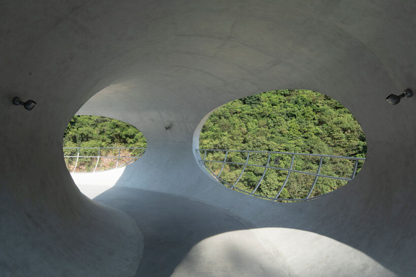tubular concrete ring by HCCH studio shapes cycling rest pavilion among chinese hills
