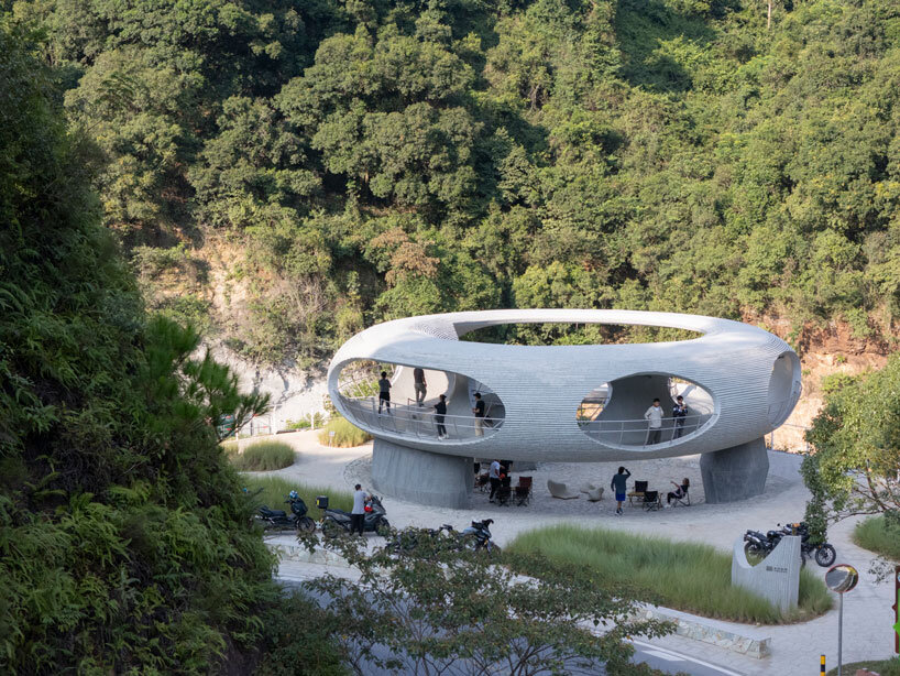 tubular concrete ring by HCCH studio shapes cycling rest pavilion among chinese hills