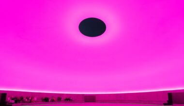 Visitors sit inside of James Turrell