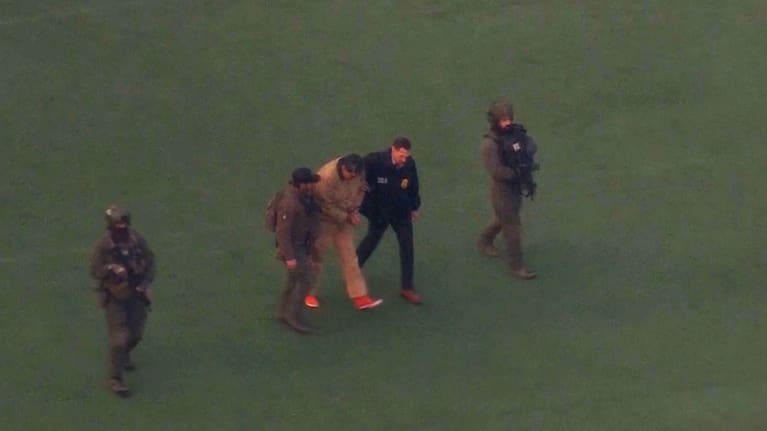 This image taken from video shows Venezuelan President Nicolas Maduro being escorted to board a helicopter for transport to Manhattan Federal Court, Monday, January 5, 2026, in New York.