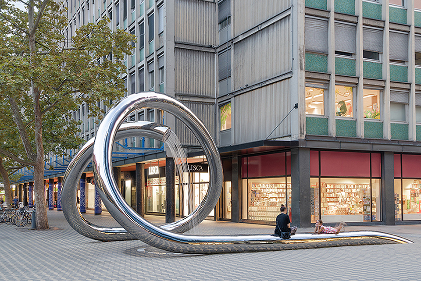 continuous steel loop forms water sculpture reflecting ljubljana’s urban fabric