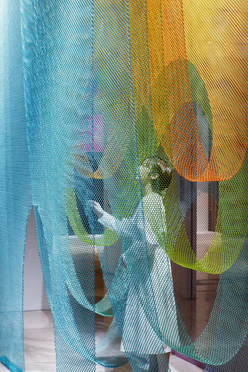 luminous layers of colored wire mesh weave tea ceremony house by moriyuki ochiai