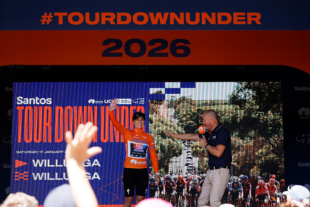 WILLUNGA, AUSTRALIA - JANUARY 17: Ally Wollaston of New Zealand and Team FDJ United - SUEZ celebrates at podium as Orange Santos Leader&amp;apos;s Jersey winner during the 10th Santos Women&amp;apos;s Tour Down Under 2026, Stage 1 a 137.4km stage from Willunga to Willunga 134m / #UCIWWT / on January 17, 2026 in Willunga, Australia. (Photo by Con Chronis/Getty Images)