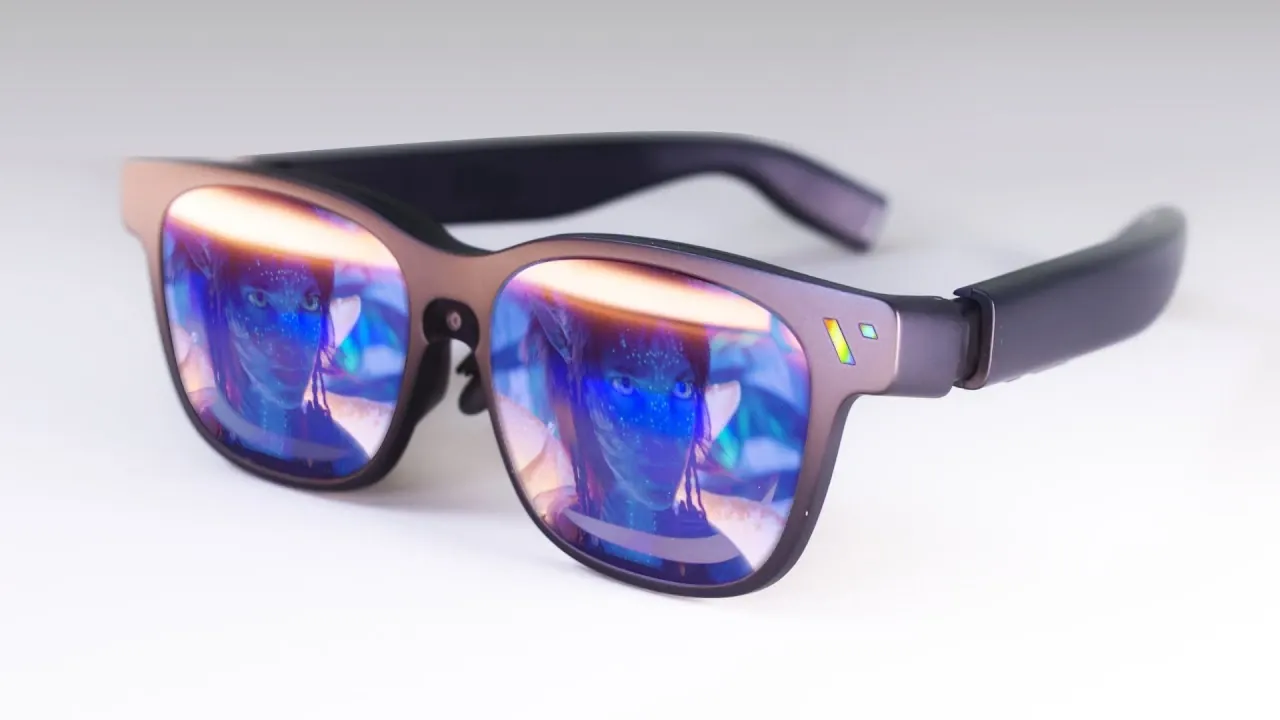 Person watching a simulated 174 inch screen through Beast XR while connected to a handheld gaming device.