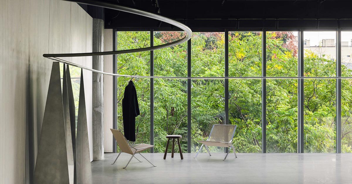 continuous steel rail traces shanghai showroom’s sculptural interior