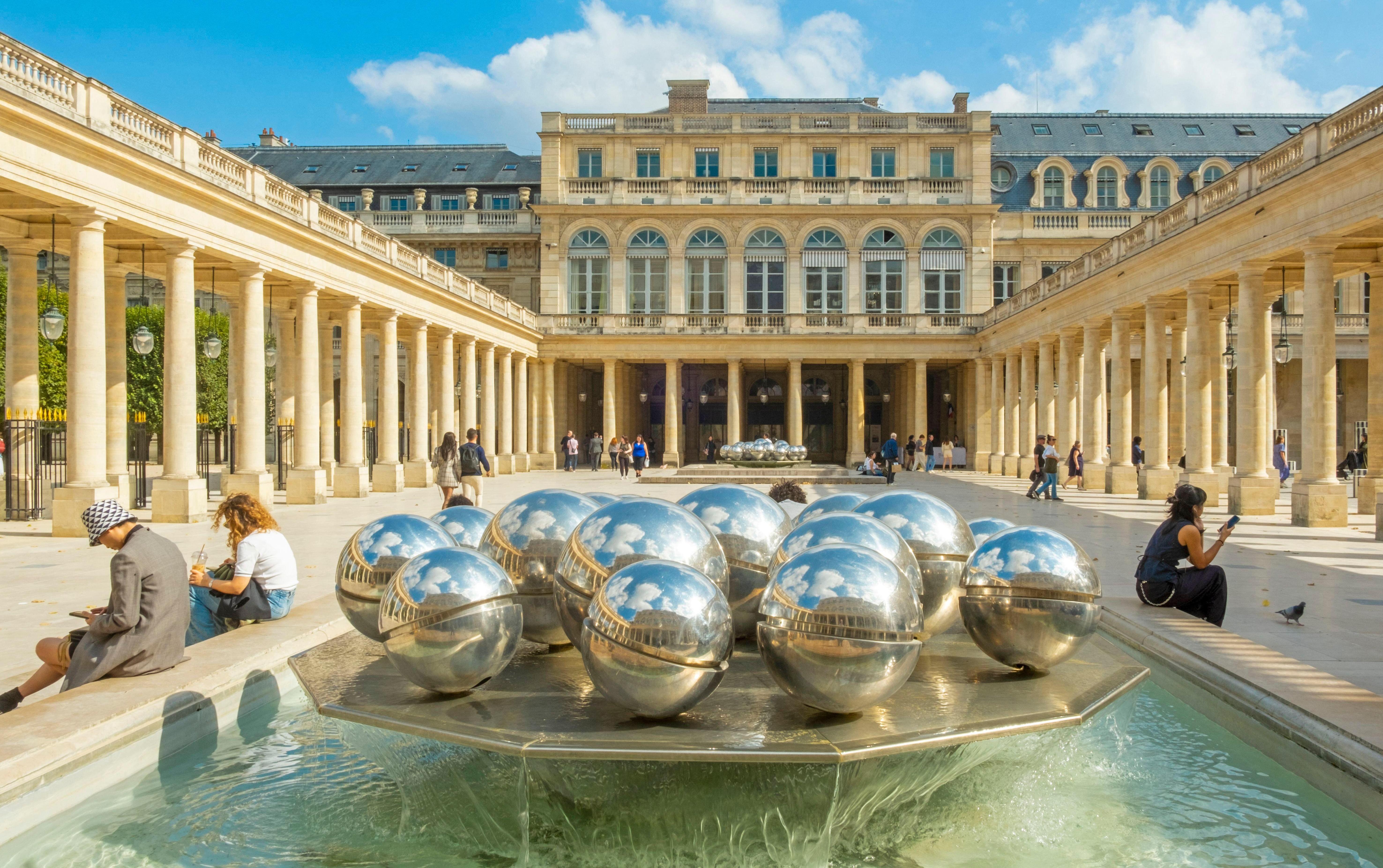 A fountain with metal spheres in the Palais-Royal, Paris, designed by sculptor Pol Bury.