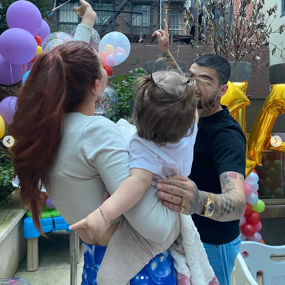 Gigi and Zayn celebrating with their daughter