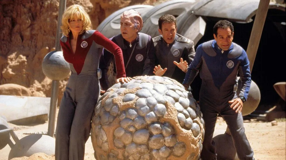 In "Galaxy Quest," a space TV show's actors -- played by Sigourney Weaver, Alan Rickman, Tim Allen and Tony Shalhoub -- become real heroes to save aliens from a warlord. - Moviestore/Shutterstock