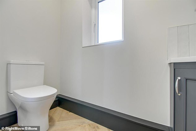 The bathroom appeared to feature a toilet that did not sit in line with the wall