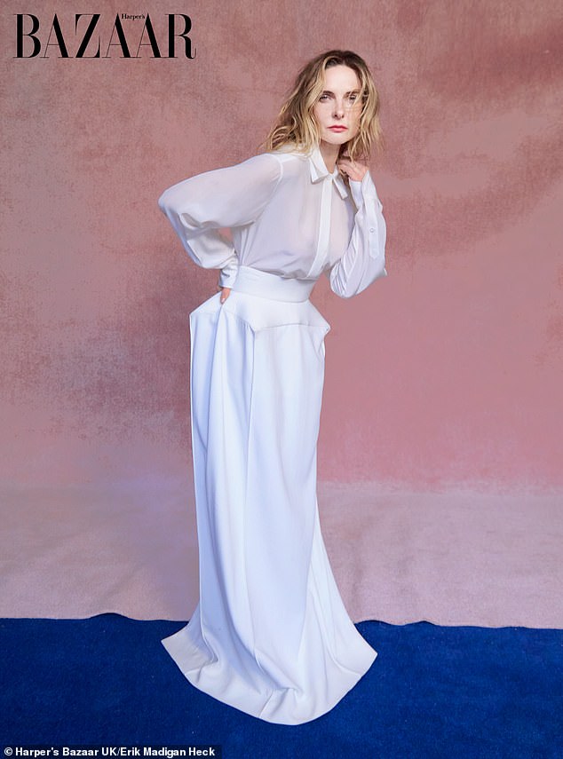 In one stunning shot, Rebecca slipped into a chic white floor-length dress as she struck a sultry pose for the camera