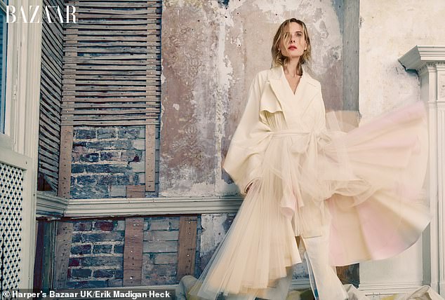 For her next look, the star slipped into a cream coat with a dramatic tulle skirt and rocked wet locks