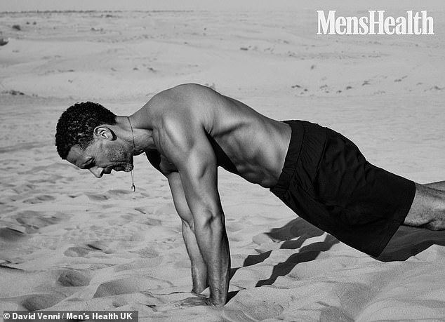 The former footballer, 47, displayed his six-pack in a shoot for Men's Health as he performed upper body workouts