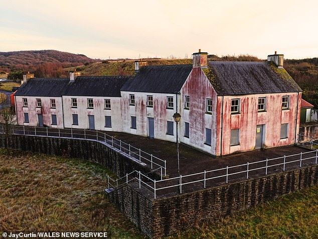 The houses were built on a former oil refinery site in Llandarcy, near Neath, South Wales, under plans to turn industrial land into a thriving new village named Coed Darcy