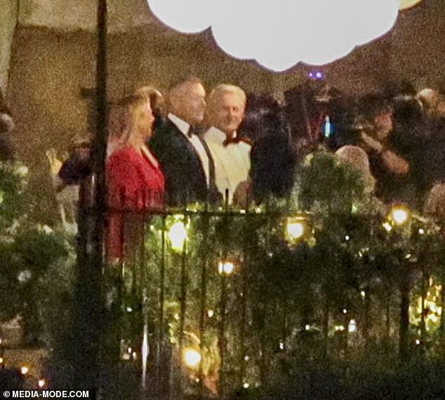 The Golden Bachelors Ed Savage and Mat Collett in evening wear alongside Samantha Armytage in the gardens of the Waterhouse-owned mansion where karaoke music until the early hours sparked complaints by neighbours and police were called