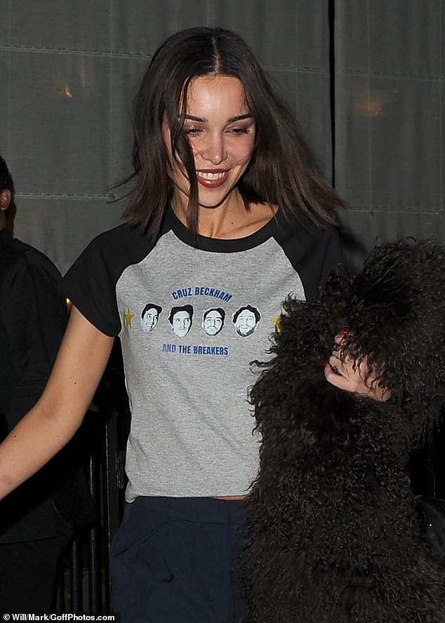 Jackie sported a T-shirt with Cruz's band members' faces printed on