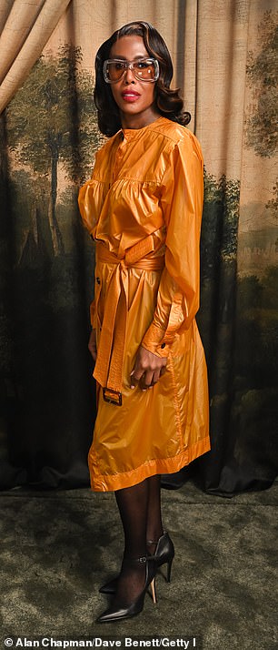 Honey Dijon made sure all eyes were on her as she wore an orange wrap dress which she paired with black tights and heels