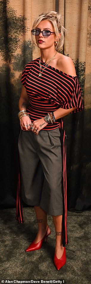 Skye Newman opted for a bold red and black striped tee which she paired with cropped suit trousers and red heels