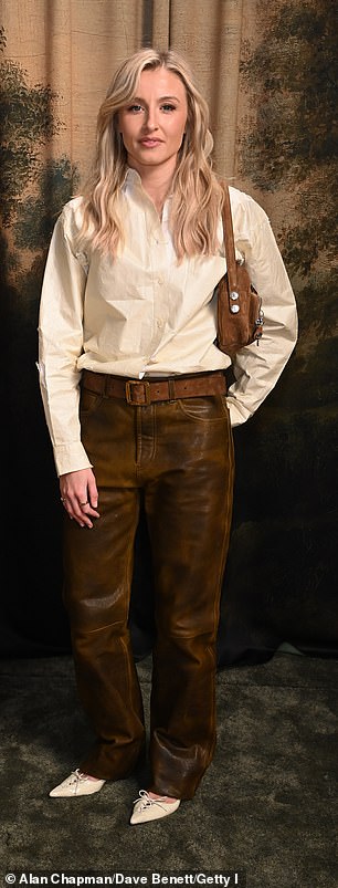 Leah Williamson opted for stylish brown leather trousers and a white shirt