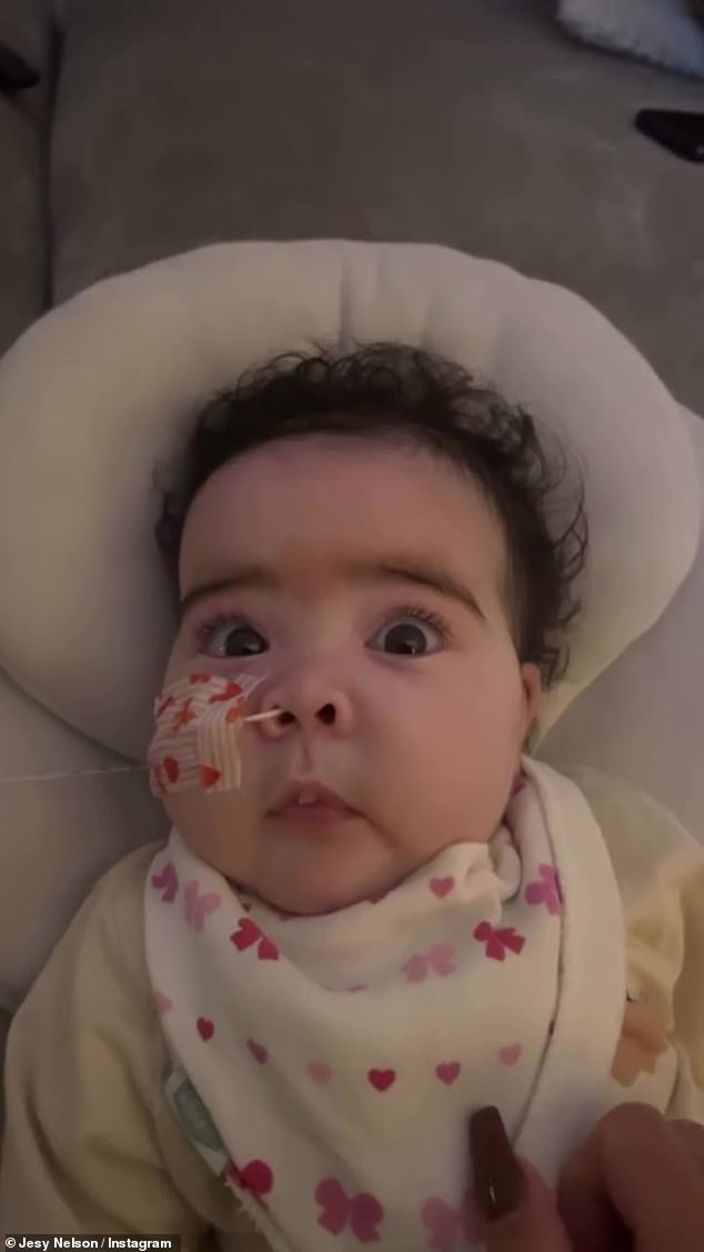 While she compared her other twin daughter to a cute Cabbage Patch doll as she ran her fingers through her curly dark hair