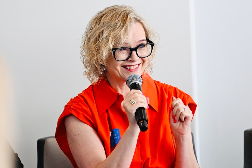 Luan Lawrenson-Woods at a speaking event.