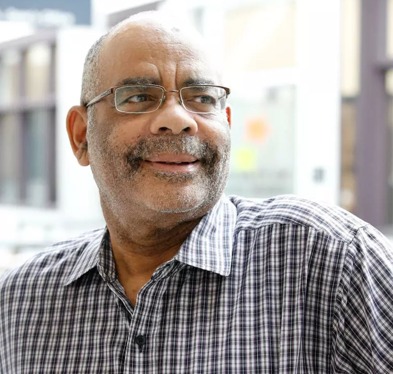 A portrait of Dr. David Este is a retired professor in the Faculty of Social Work at the University of Calgary