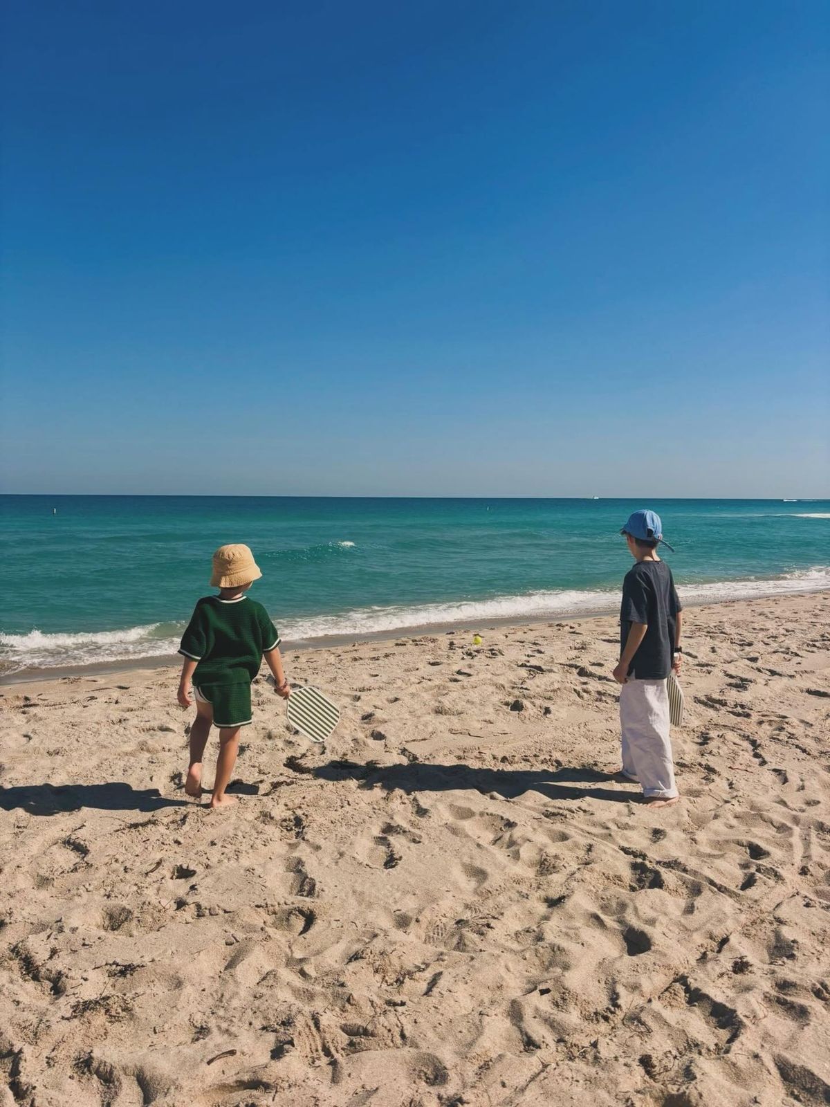 Robbie William's children playing on a beach