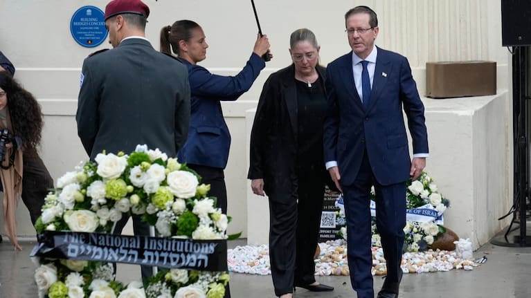 Israel's President Isaac Herzog, right, and his wife Michal Herzog, second right, visit Bondi Beach.