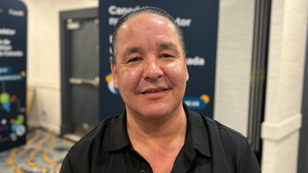 A man in a black shirt.