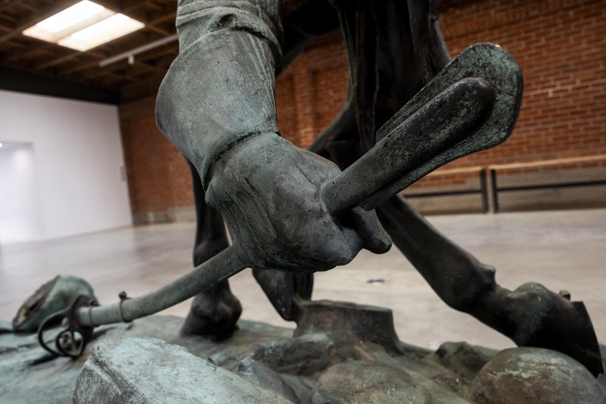 A detail of a sword on a Stonewall Jackson sculpture.