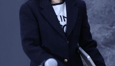 Min Hee-jin, CEO of Ooak Records, enters a press conference in Seoul’s Jongno District, Wednesday, calling for an end to ongoing legal disputes with Ador