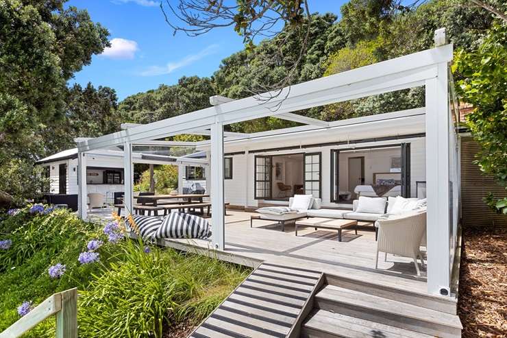 Kelly and Nathan Coe have listed their five-bedroom holiday escape at Te Kapa Inlet, in Mahurangi East. Photo / Supplied