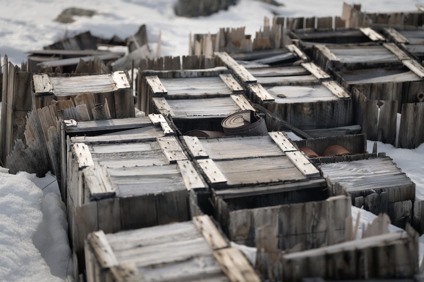 Old crates in the snow.