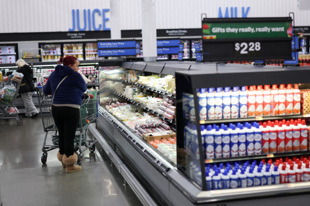 FILE PHOTO: Customers shop for groceries at Walmart Supercenter retail store in North Bergen, New Jersey