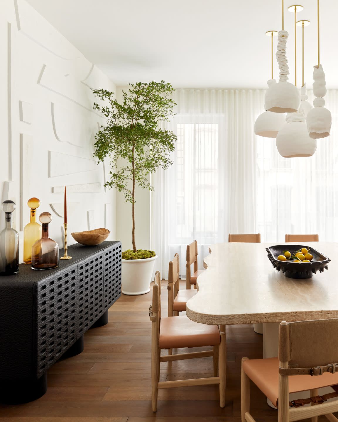a dining room with a table and chairs