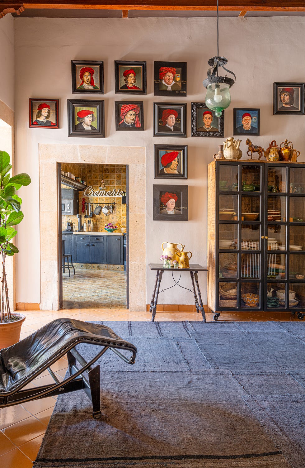 Cozy interior featuring artwork and kitchen view
