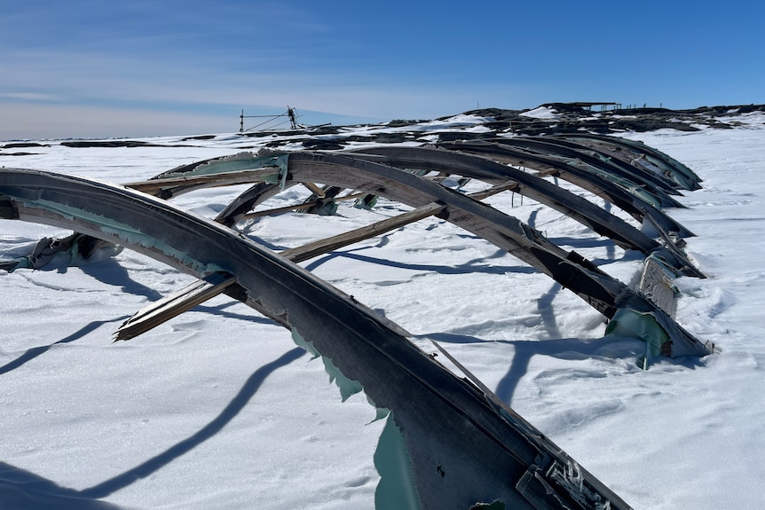Images of an abandoned station in the icy and snowy Antarctic wilderness.