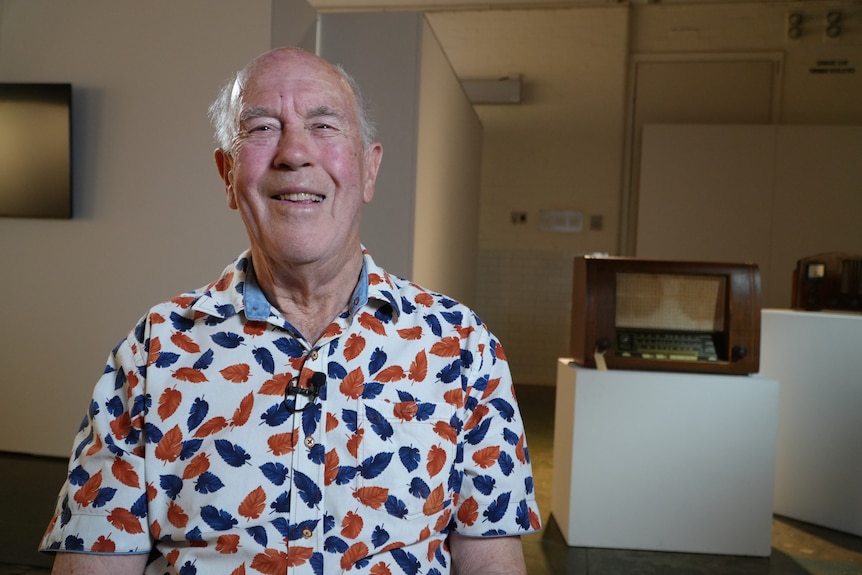 Man in colourful shirt smiling