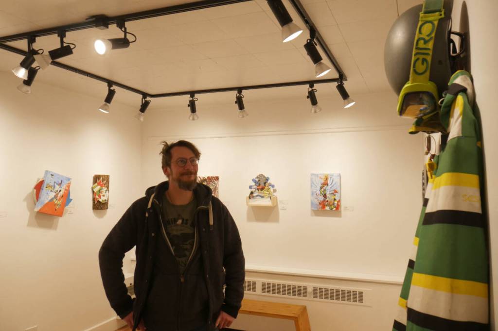 Painter Jacques Moeder admires his Story of a Crash exhibit at the Revelstoke Visual Arts Centre on Wednesday, Jan. 28. (Evert Lindquist/Revelstoke Review)