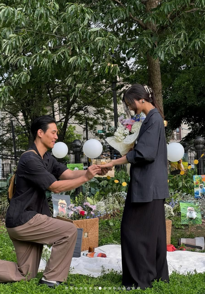 Singer-songwriter EJAE, right, getting proposed by her fiance Sam Kim, in a photo uploaded to the singer's Instagram account on Jan. 26, 2026 [SCREEN CAPTURE]