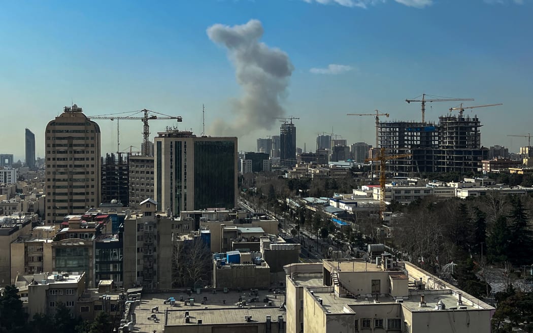A plume of smoke rises following a reported explosion in Tehran on February 28, 2026. Israel's defence ministry announced February 28 it had launched a "preemptive strike" on Iran as sirens sounded in Jerusalem and people across the country received phone alerts about an "extremely serious" threat. (Photo by AFP)
