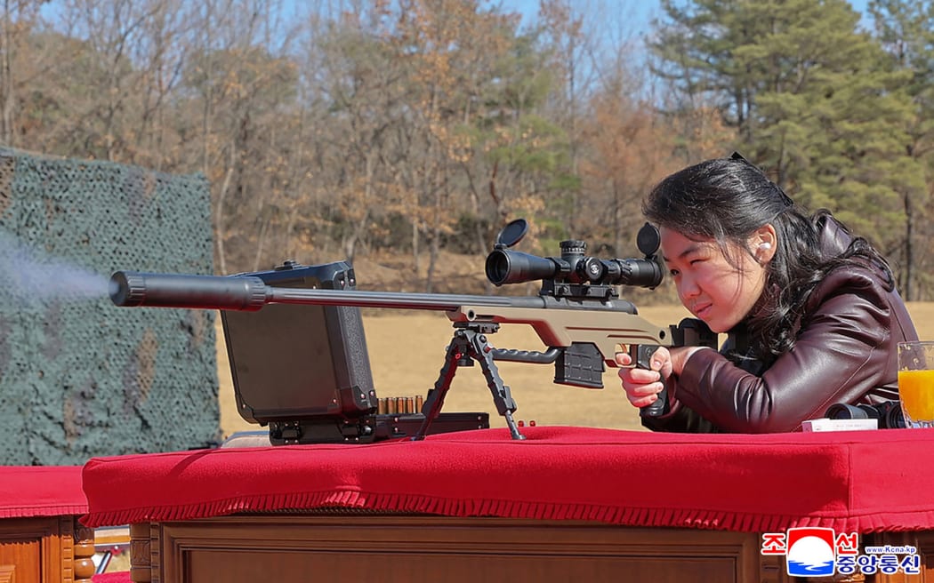 This picture taken on February 27, 2026 and released by North Korea's official Korean Central News Agency (KCNA) via KNS on February 28, 2026 shows North Korean leader Kim Jong Un's daughter Kim Ju Ae firing a new sniper rifle, at an undisclosed place in North Korea. (Photo by KCNA VIA KNS / AFP) / South Korea OUT / SOUTH KOREA OUT / ---EDITORS NOTE--- RESTRICTED TO EDITORIAL USE - MANDATORY CREDIT "AFP PHOTO/KCNA VIA KNS" - NO MARKETING NO ADVERTISING CAMPAIGNS - DISTRIBUTED AS A SERVICE TO CLIENTS
THIS PICTURE WAS MADE AVAILABLE BY A THIRD PARTY. AFP CAN NOT INDEPENDENTLY VERIFY THE AUTHENTICITY, LOCATION, DATE AND CONTENT OF THIS IMAGE. /