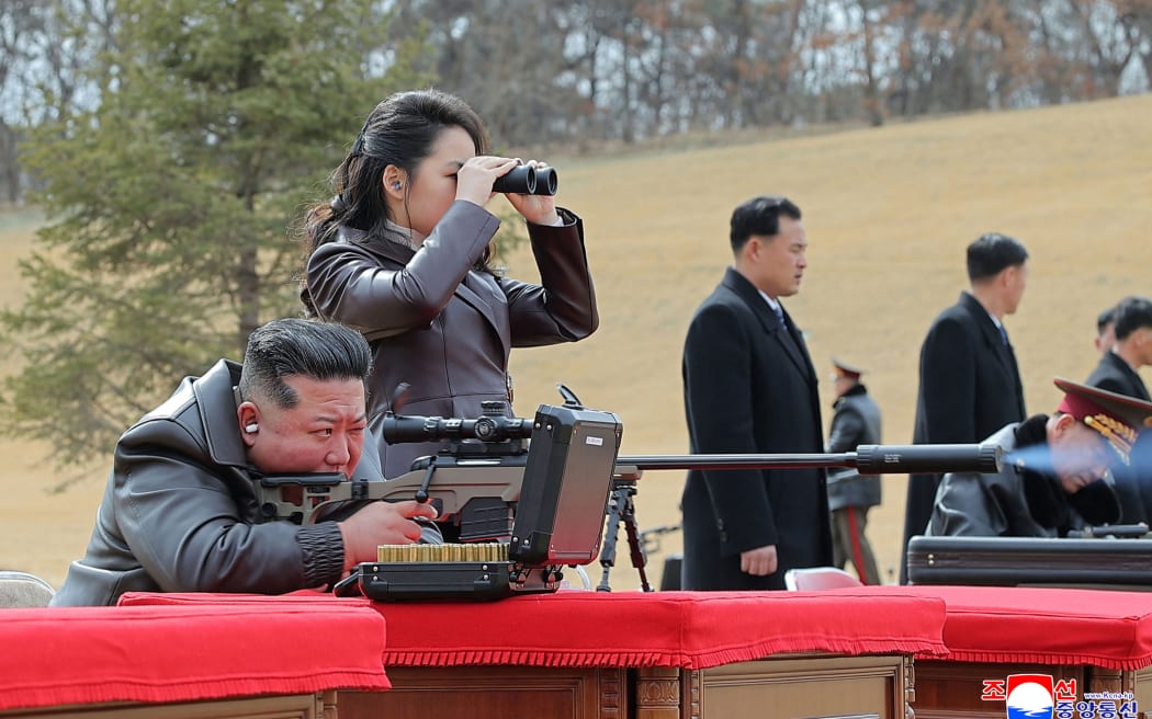 This picture taken on February 27, 2026 and released by North Korea's official Korean Central News Agency (KCNA) via KNS on February 28, 2026 shows North Korean leader Kim Jong Un (L) firing a new sniper rifle with his daughter Kim Ju Ae , at an undisclosed place in North Korea. (Photo by KCNA VIA KNS / AFP) / South Korea OUT / SOUTH KOREA OUT / ---EDITORS NOTE--- RESTRICTED TO EDITORIAL USE - MANDATORY CREDIT "AFP PHOTO/KCNA VIA KNS" - NO MARKETING NO ADVERTISING CAMPAIGNS - DISTRIBUTED AS A SERVICE TO CLIENTS
THIS PICTURE WAS MADE AVAILABLE BY A THIRD PARTY. AFP CAN NOT INDEPENDENTLY VERIFY THE AUTHENTICITY, LOCATION, DATE AND CONTENT OF THIS IMAGE. /