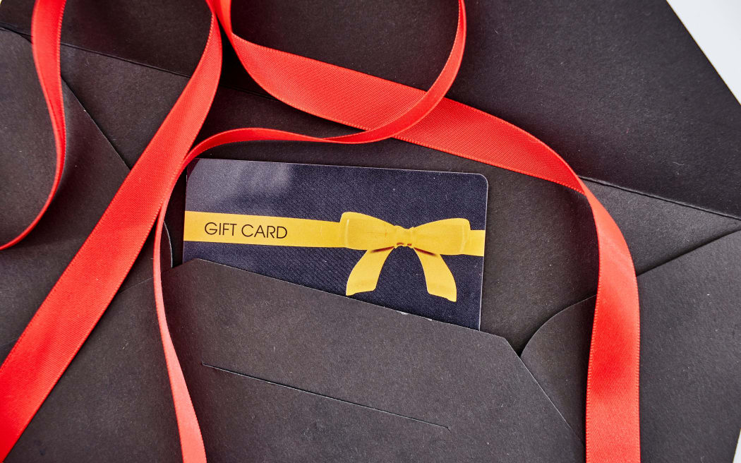 A studio photo of a black envelope