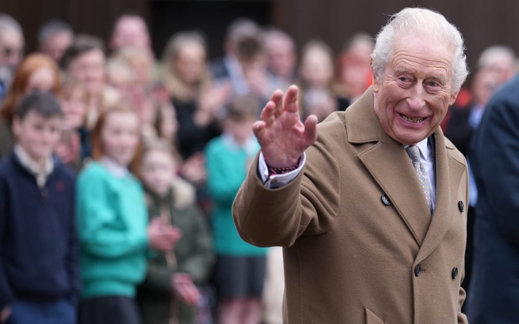 Britain's King Charles III waves as he leaves after a visit to Butlers Dairy in Inglewhite, near Preston, north-west England on February 9, 2026, to mark the opening of new facilities following a fire in 2023. (Photo by Jon Super / POOL / AFP)