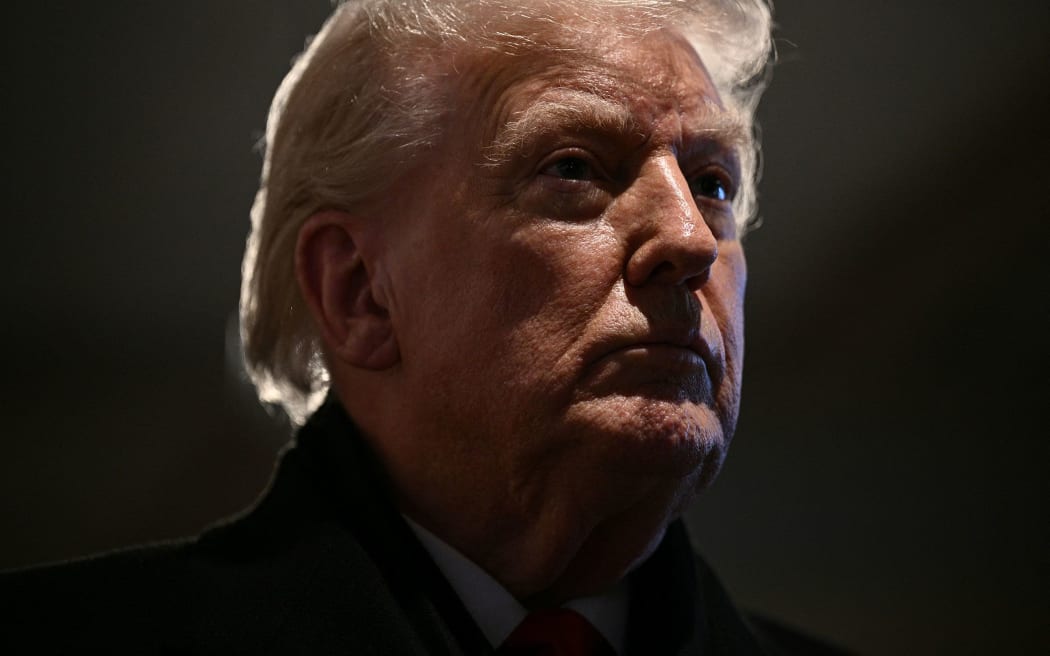 US President Donald Trump speaks during a stop at the Machine Shed restaurant in Urbandale, Iowa, on 27 January.