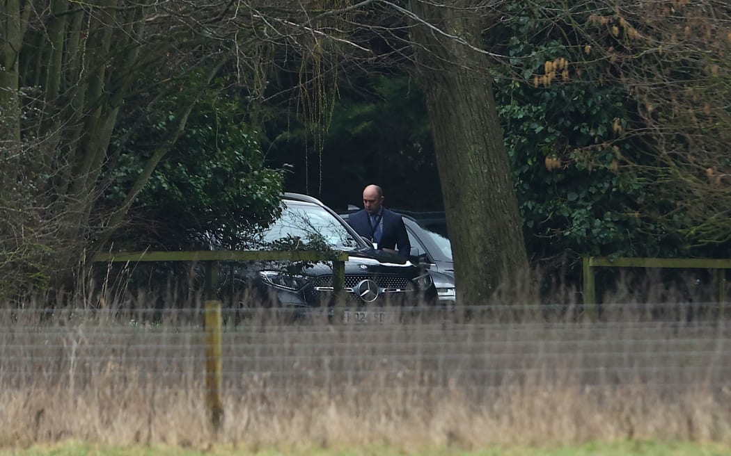 A man steps out of umarked car at the home of Andrew Mountbatten-Windsor on February 19, 2026 in Sandringham, Norfolk.