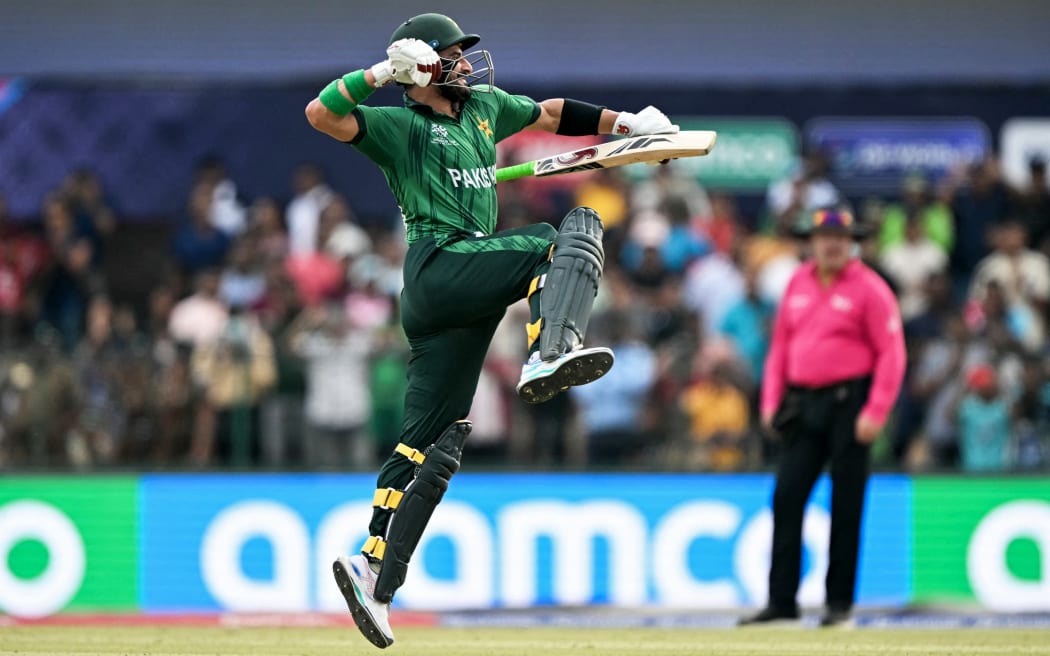 Pakistan's Sahibzada Farhan celebrates after scoring a century (100 runs) during the 2026 ICC Men's T20 Cricket World Cup group stage match between Pakistan and Namibia at the Sinhalese Sports Club (SSC) Ground in Colombo on February 18, 2026. (Photo by Ishara S. KODIKARA / AFP)